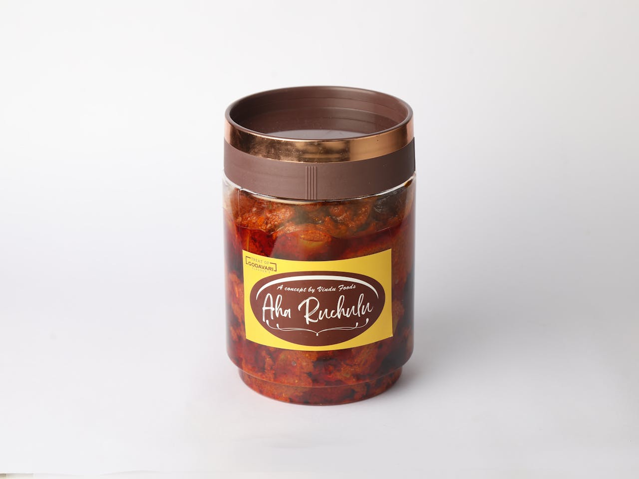 A close-up of a jar of Aha Ruchulu spicy mango pickle with a brown lid, perfect for Indian cuisine lovers.